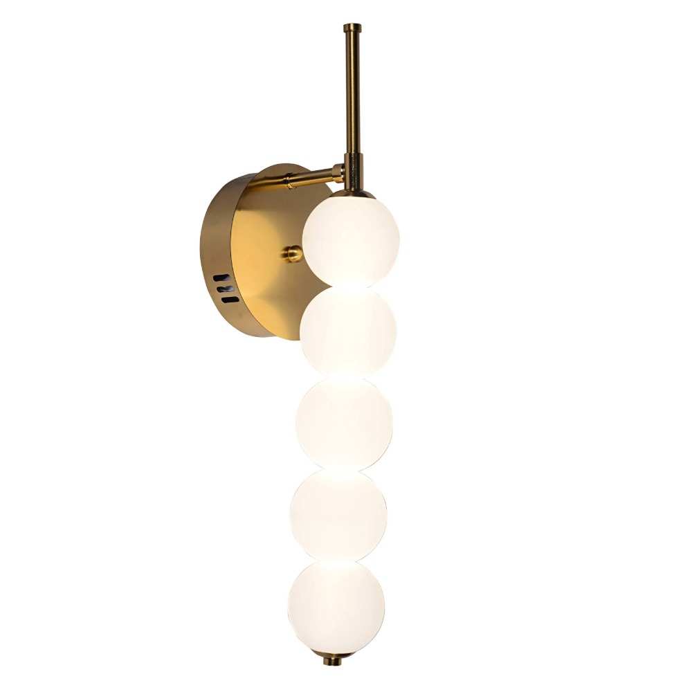 Elegant gold LED wall light fitted on an interior wall